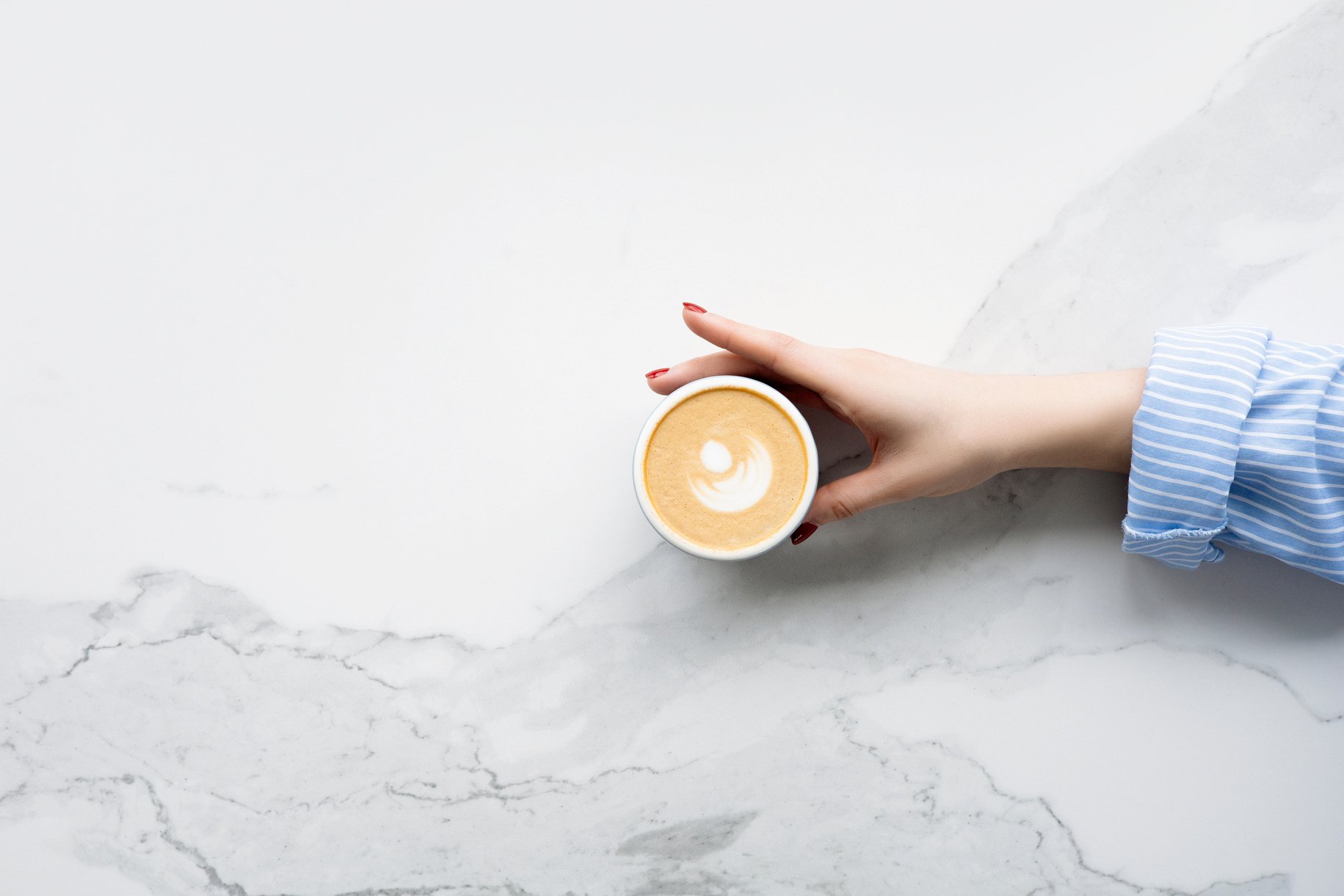 Person Holding Cup of Coffee